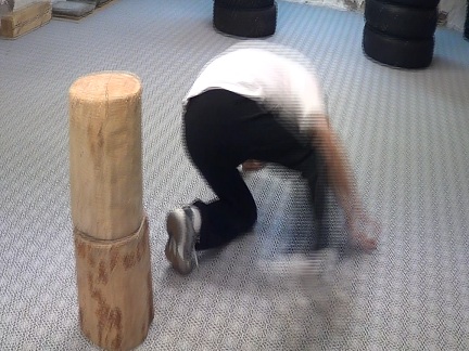 Da Sifu Louis Linn sweeps two logs, one on top of the other, their weight is 15 kg and 18 kg, 4 June 2012